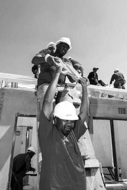 IDE Global Link factory-trained roofing installation team at work